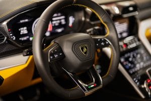 Ternopil, Ukraine- November 11, 2022:  Steering wheel of yellow Lamborghini Urus.